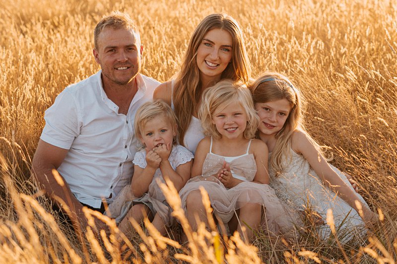 Family sunset portrait, sunkissed portraits in long grass